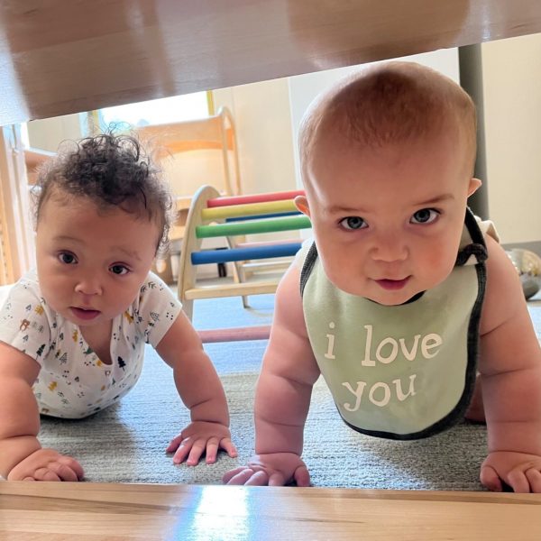 Babies Two happy infants crawl towards the camera.